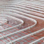 Underfloor heating installation. Close up on water floor heating system interior. plumbing pipes. Individual Heating.